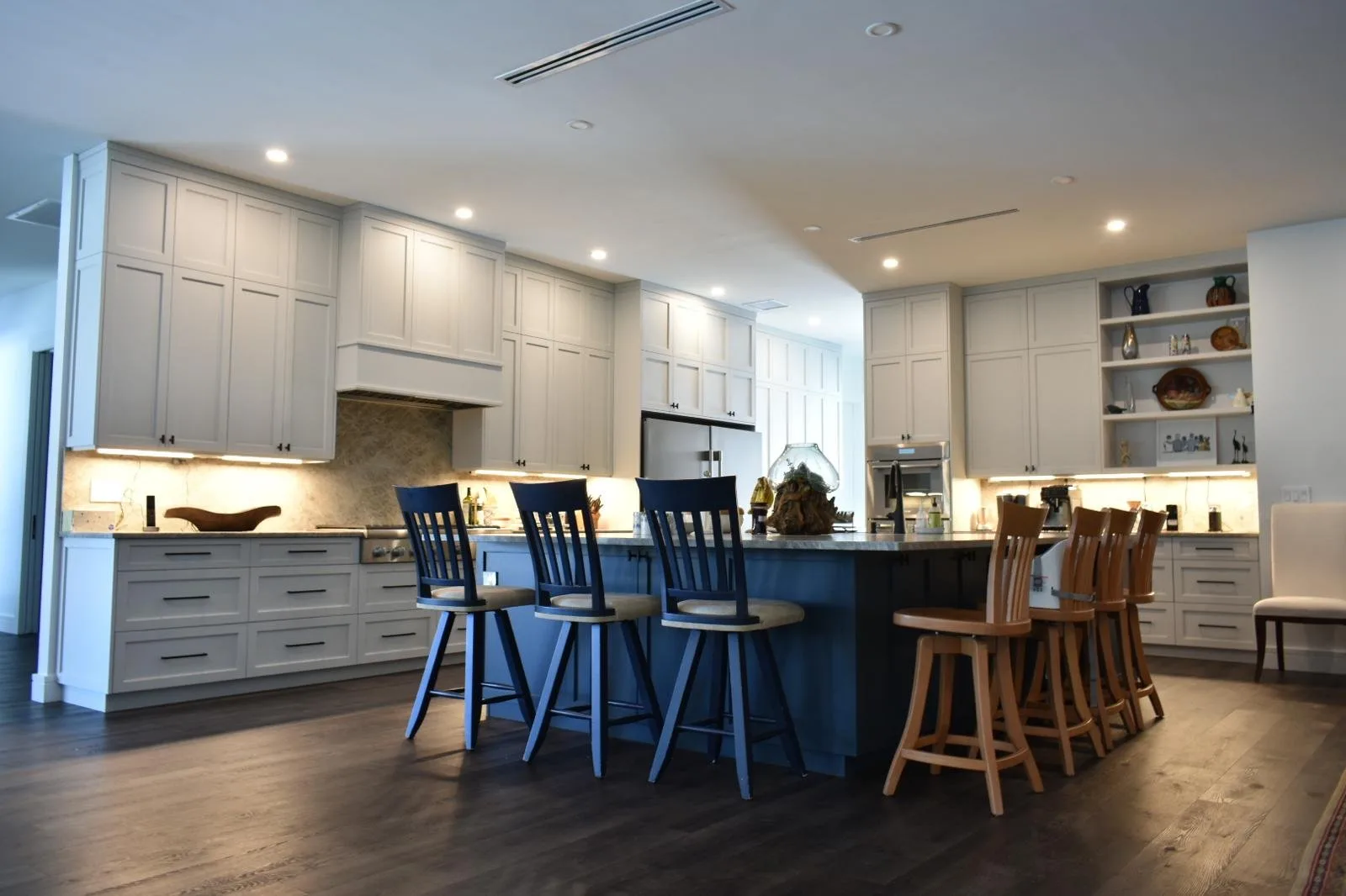 A fully refinished kitchen with restored cabinetry and hardwood floors